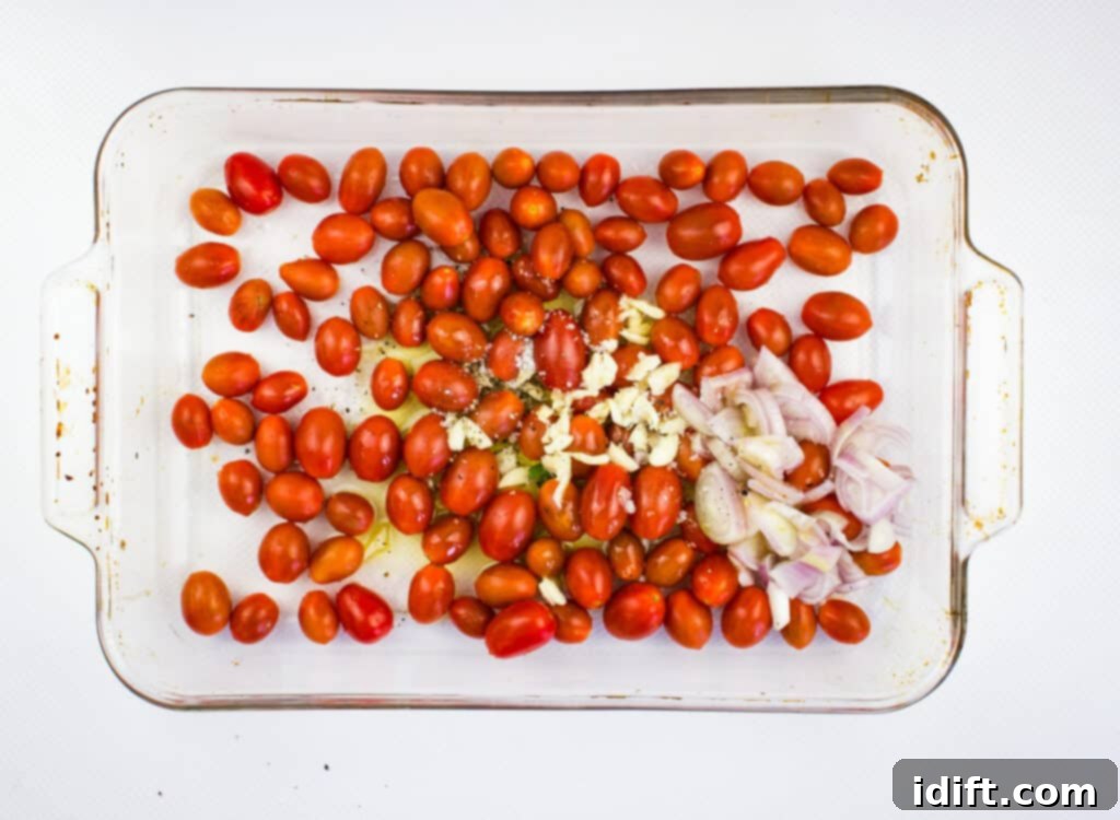 Mixing tomatoes, shallot, garlic, and olive oil.