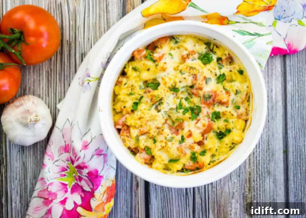 Baked pasta with ricotta and tomatoes in a casserole dish