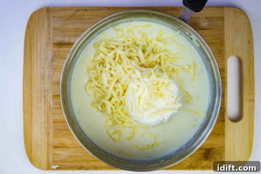 cheeses added to the sauce that's been cooked with milk