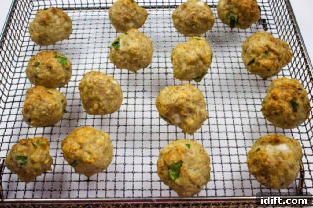 Perfectly cooked and juicy air fryer turkey meatballs hot out of the air fryer.