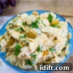 curried chicken salad with raisins in a serving bowl