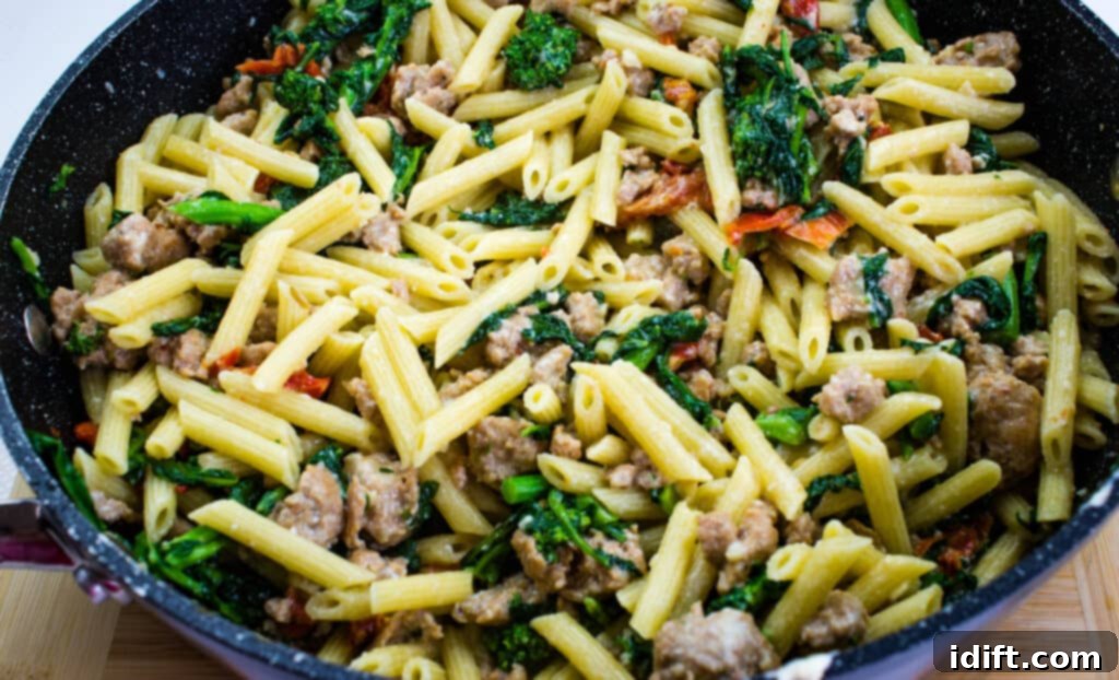 Robust Sausage & Broccoli Rabe Pasta 9 tossing with cooked pasta