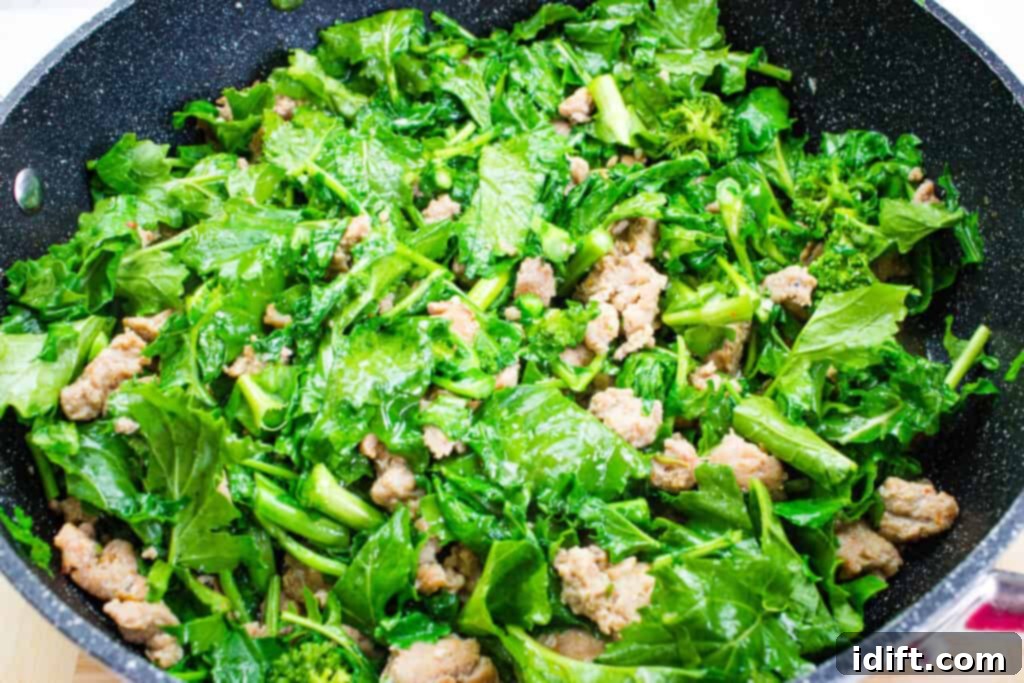 Robust Sausage & Broccoli Rabe Pasta 6 adding the chopped broccoli rabe to the skillet