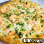 Lemon-Garlic Shrimp Pizza 11 A shrimp scampi pizza loaded with melted cheese.