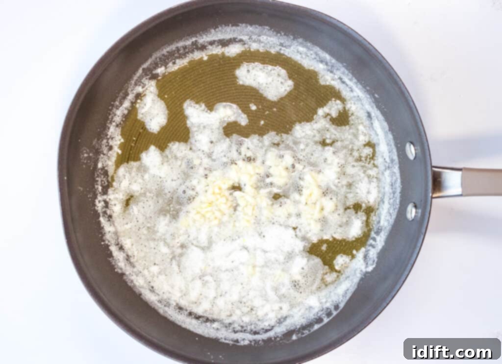 Lemon-Garlic Shrimp Pizza 5 Butter sizzling in a skillet, preparing for garlic infusion.