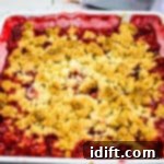 Blissful Strawberry Rhubarb Crumble 10 small image of a baked strawberry rhubarb crumble