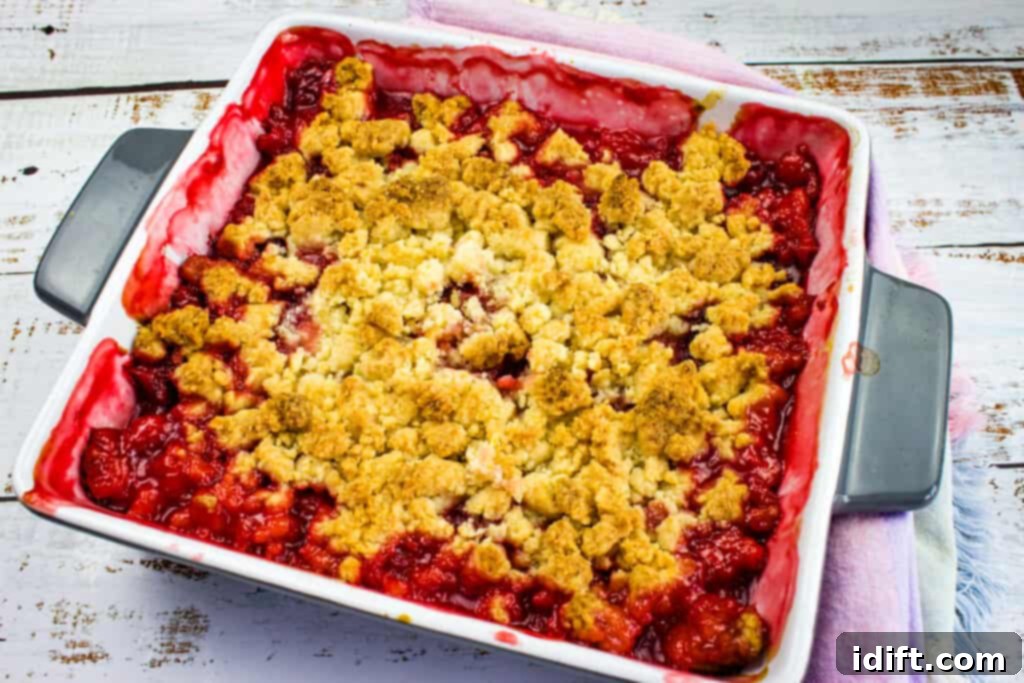 Blissful Strawberry Rhubarb Crumble 3 close-up of baked strawberry rhubarb crumble with bubbling fruit