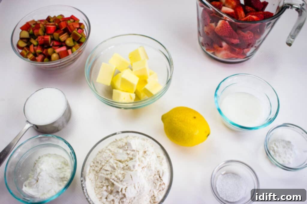 Blissful Strawberry Rhubarb Crumble 5 prepped ingredients to make rhubarb and strawberry crumble, with rhubarb chopped and strawberries hulled