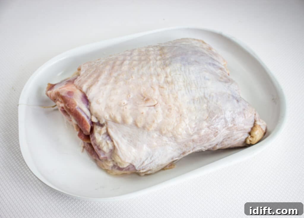 Trim excess fat from turkey thighs.