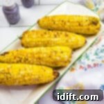 Crispy Air Fryer Corn Perfection 5 air fryer corn on the cob recipe finished and ready to eat