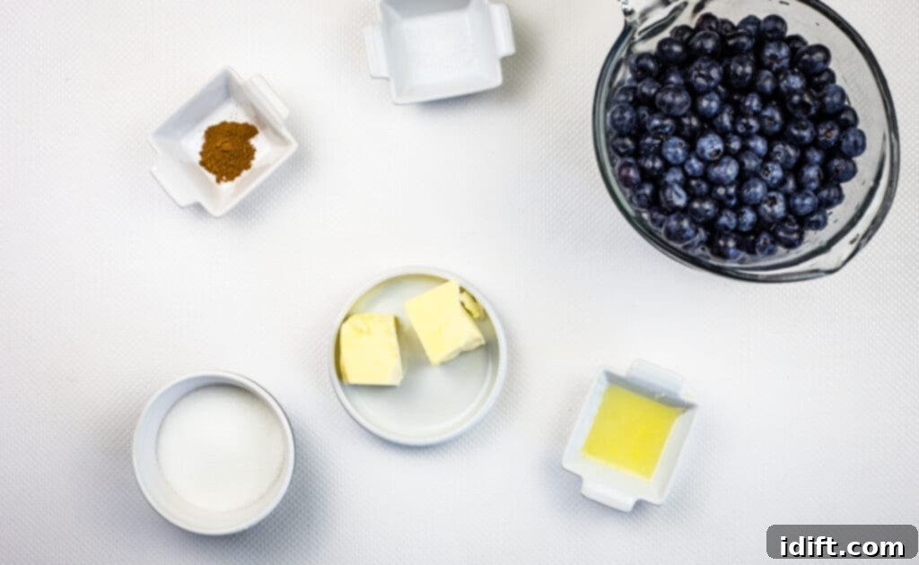 Fresh blueberries and other ingredients laid out to make the flavorful blueberry grunt filling.