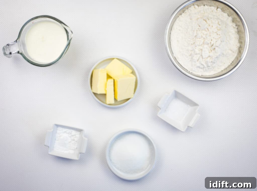 Flour, sugar, baking powder, and cold butter, the essential components for the tender biscuit topping.