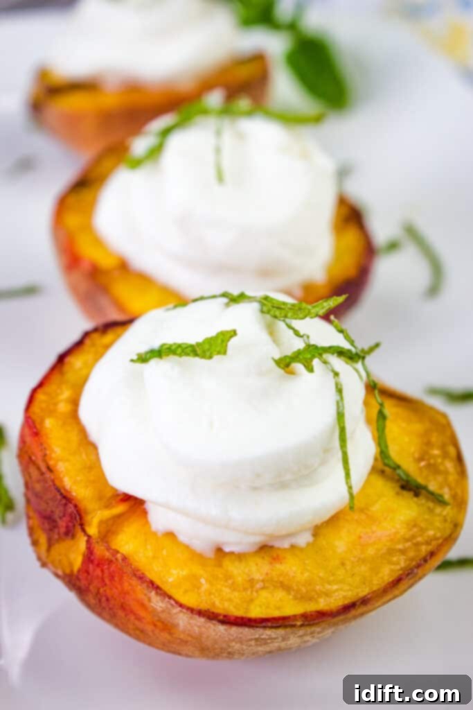 smoked peaches with spiced rum whipped cream on a platter