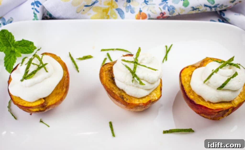 smoked peaches with spiced rum whipped cream on a platter