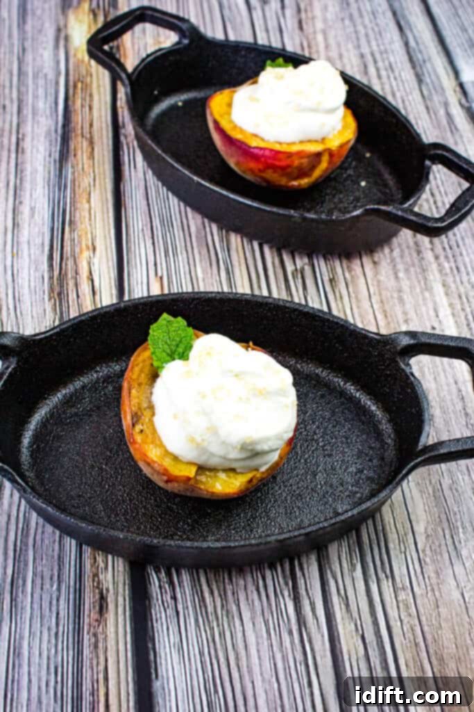 smoked peaches with spiced rum whipped cream in black dishes