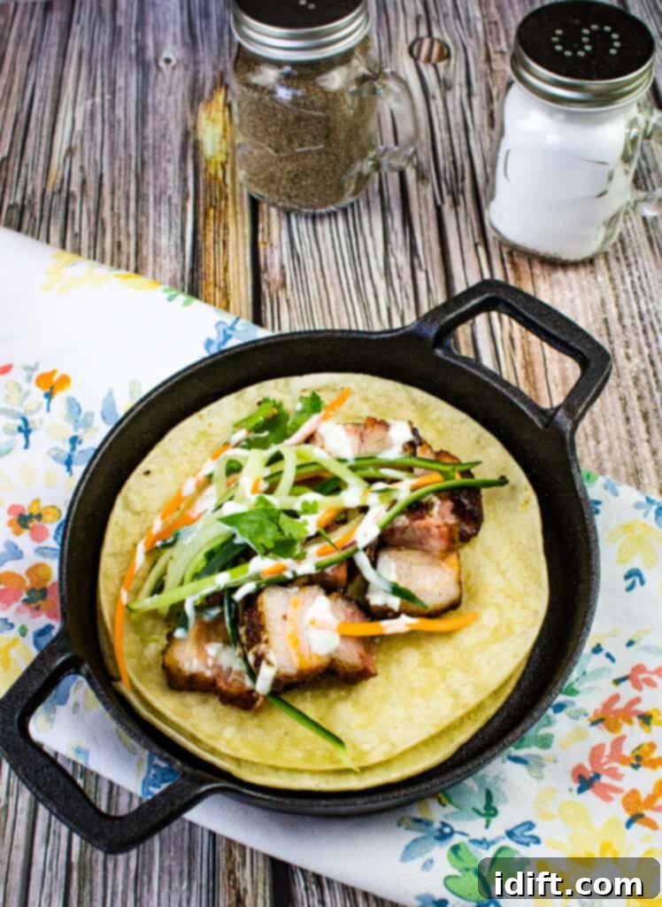 smoked pork belly tacos in a black pan