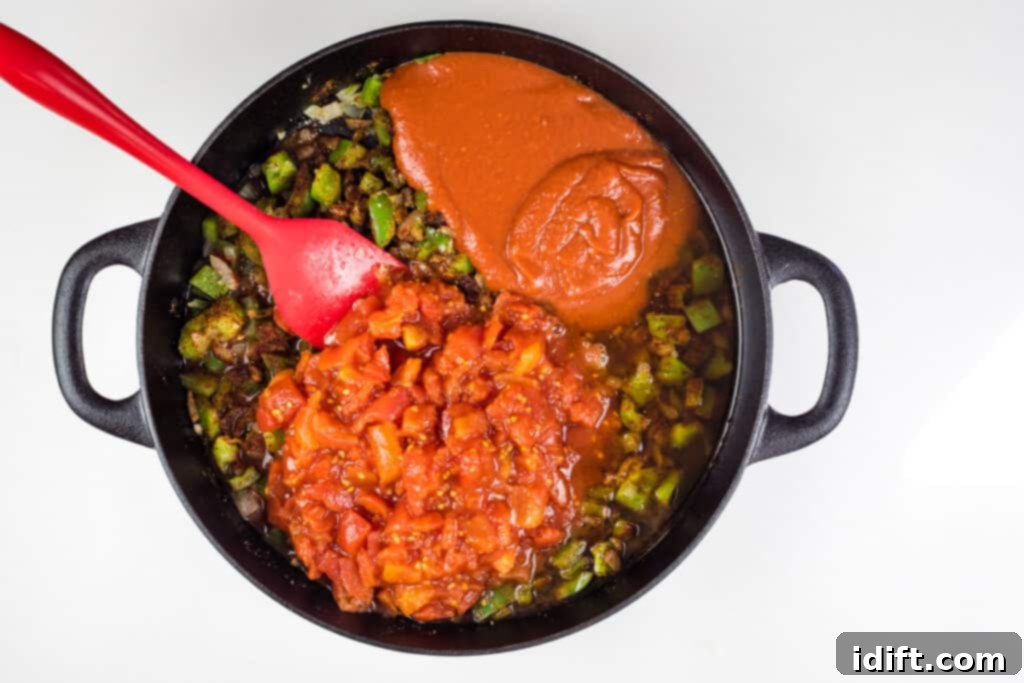 adding tomatoes to over the top chili reicpe