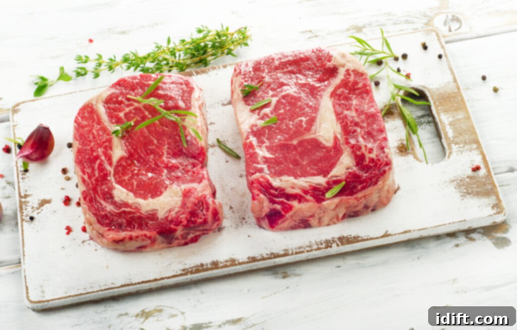 Blackstone Griddle Steaks: Sizzle to Perfection 3 ribeye steaks on cutting board
