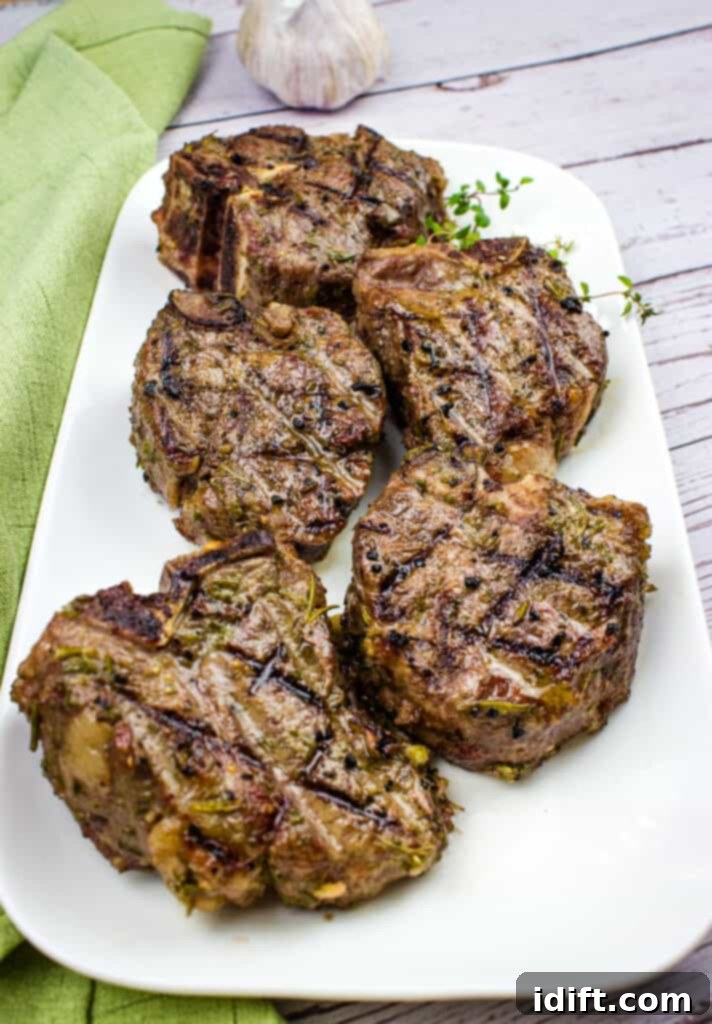 Smoked lamb chops artfully arranged on a platter, ready to be served