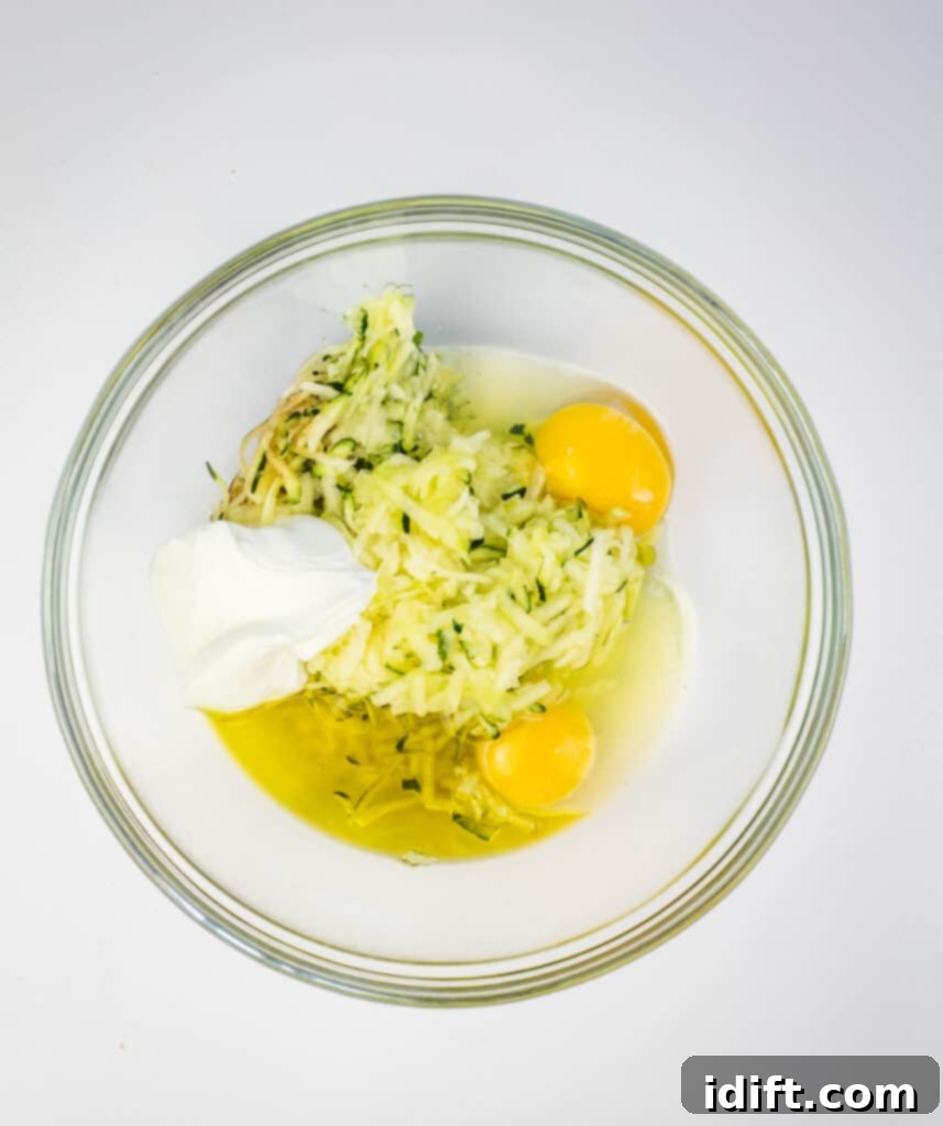 Irresistible Zucchini Bread 6 Combining the wet ingredients in a mixing bowl.