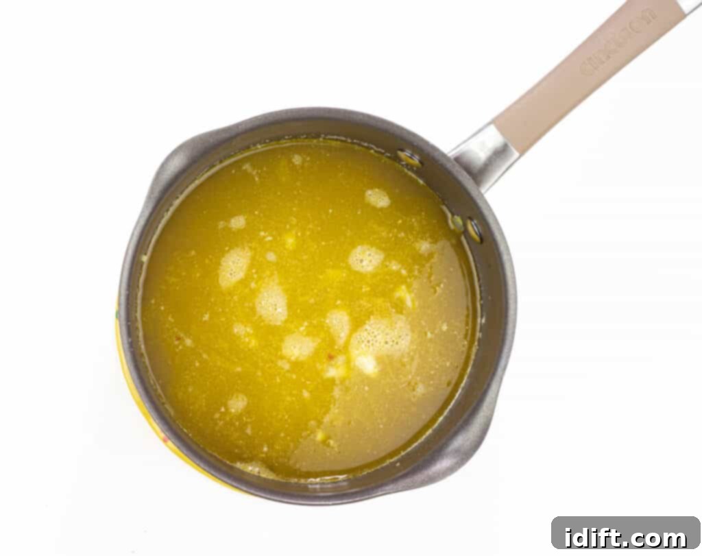 Hearty Chicken and Sweet Corn Chowder 8 adding broths to the veggies and simmering.