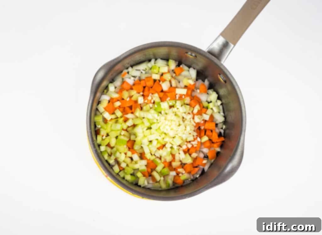 Hearty Chicken and Sweet Corn Chowder 7 sauteeing the veggies in a pot