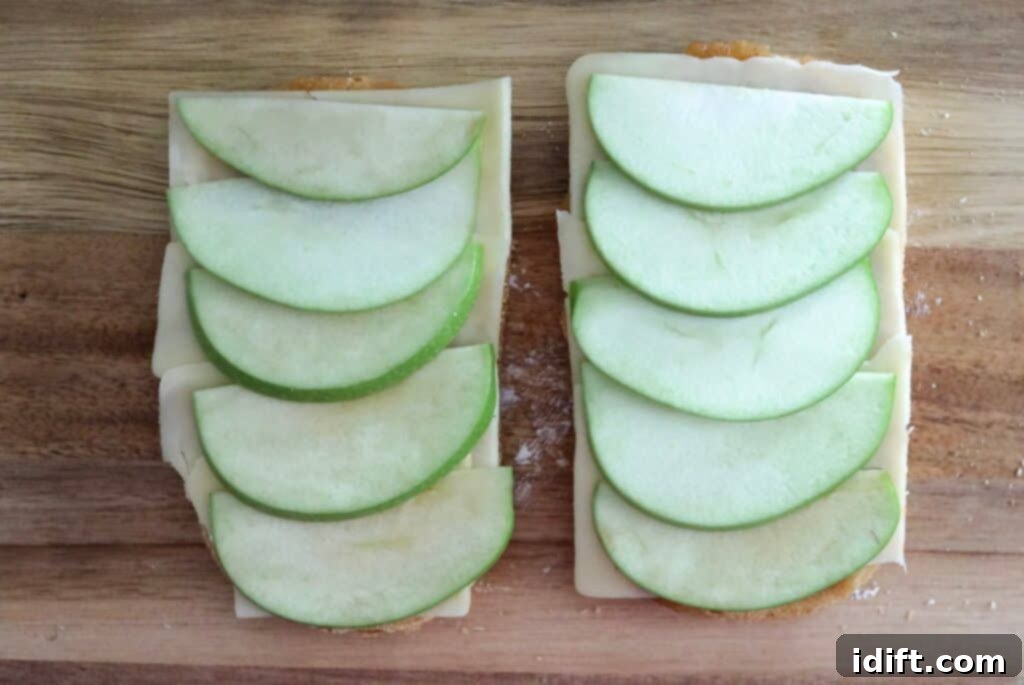 Add a layer of crisp, thinly sliced apples for texture and flavor.