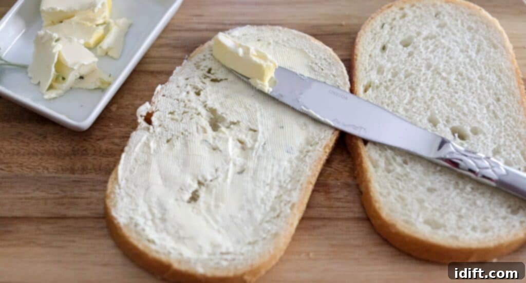 Butter one side of the bread generously for a crispy Turkey & apple panini.