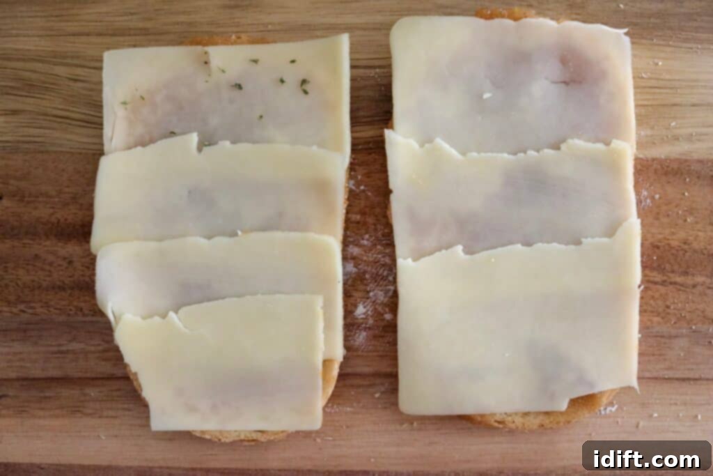 Layer thinly sliced sharp cheddar cheese over the apple butter.