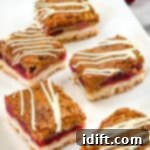 Tangy Cranberry Squares 18 Cranberry bars on a plate, close up