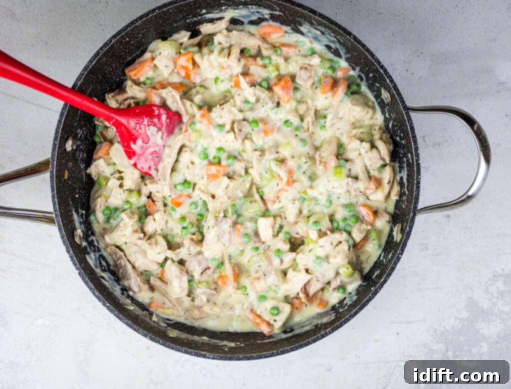 The finished turkey pot pie filling, heated through and ready for assembly.