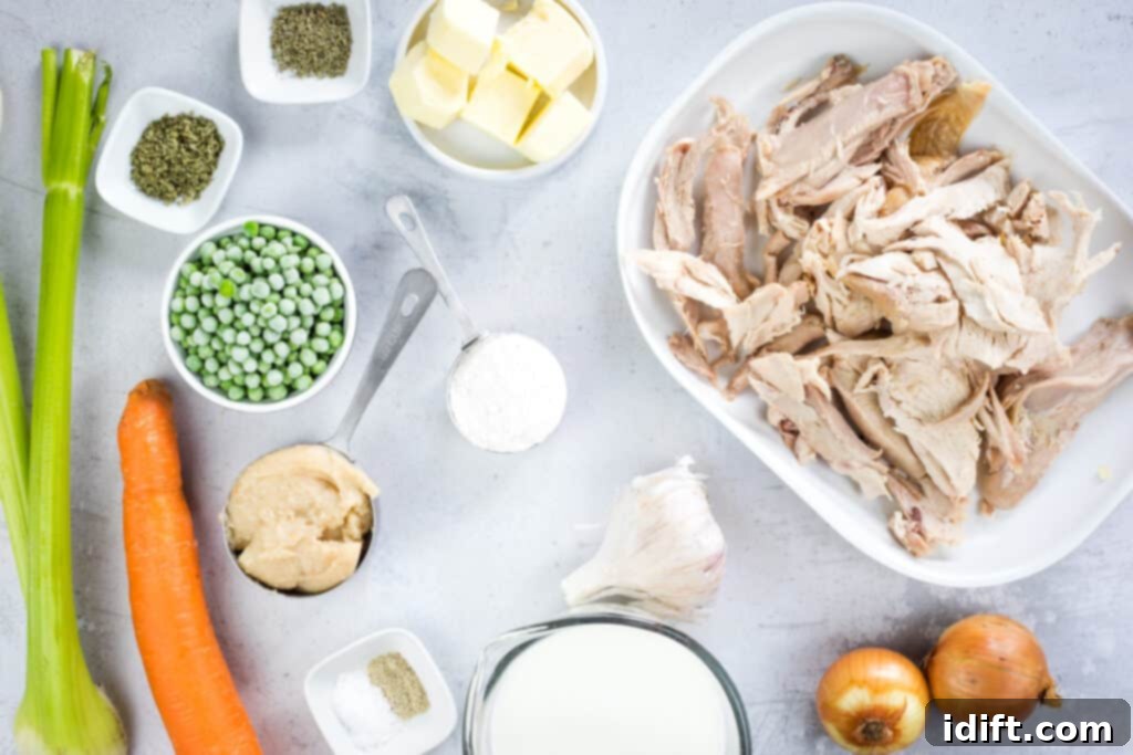 All the fresh and pantry ingredients laid out for making turkey pot pies with puff pastry.