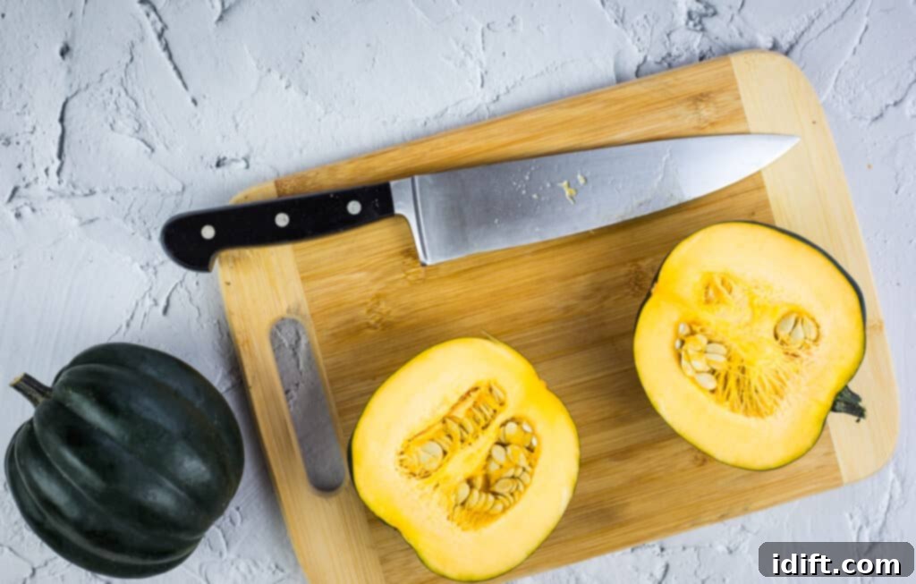 Golden Maple Acorn Squash 6 cutting acorn squash in half for maple roasted acorn squash