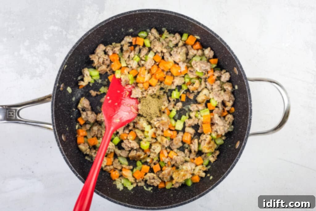 sauteeing the sausage and veg in a skillet