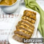 german pork loin slow cooker with gravy in the background