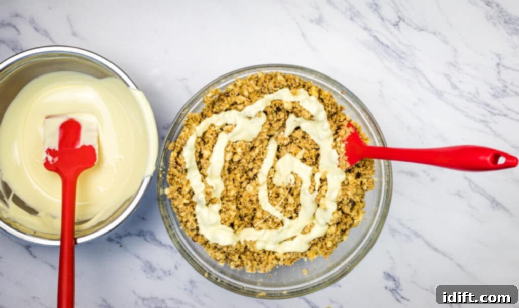 Decadent White Chocolate Bourbon Bites 9 Mixing in the melted white chocolate.