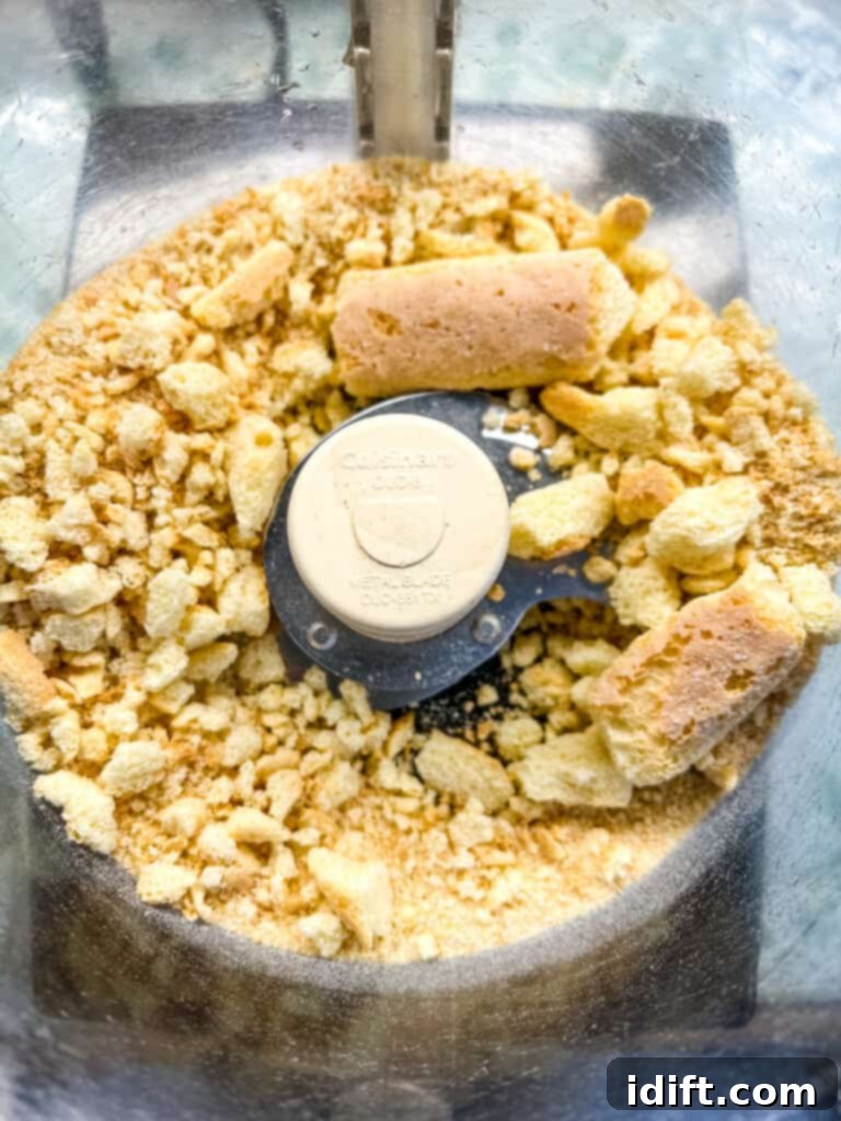 Decadent White Chocolate Bourbon Bites 5 Pulsing the ladyfinger cookies in the food processor.