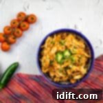 Easy Instant Pot Chicken Tinga 10 chicken tinga instant pot recipe in a serving bowl, garnished with cilantro
