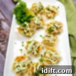 Crispy Chicken Tortilla Cups 4 chicken tortilla cups on a white platter