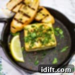 Grilled Feta with Grilled Bread in a round cast iron dish