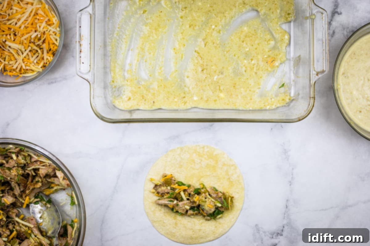 Filling and rolling chicken enchiladas.