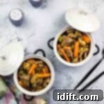 leftover roast beef stew in 2 serving dishes with spoons