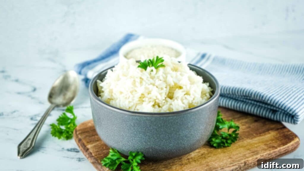 Foolproof Instant Pot Rice 3 A serving of fluffy white rice, freshly cooked in the Instant Pot, presented in a rustic bowl.