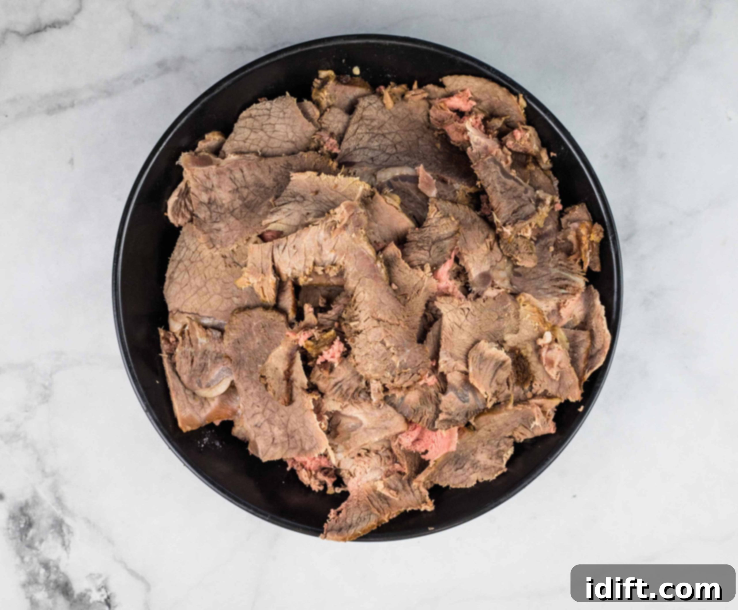 Easy Instant Pot Italian Beef Sandwiches 10 Sliced beef for Italian beef sandwiches.