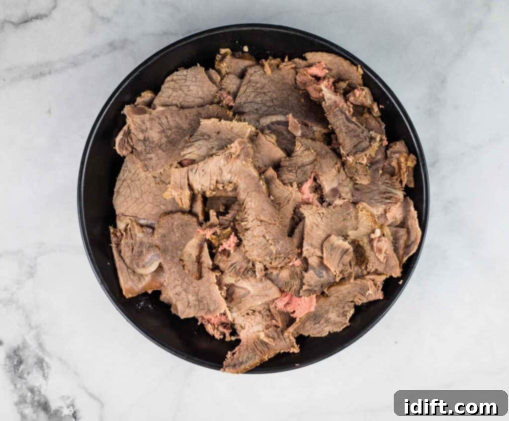 Easy Instant Pot Italian Beef Sandwiches 3 Sliced beef for Italian beef sandwiches.