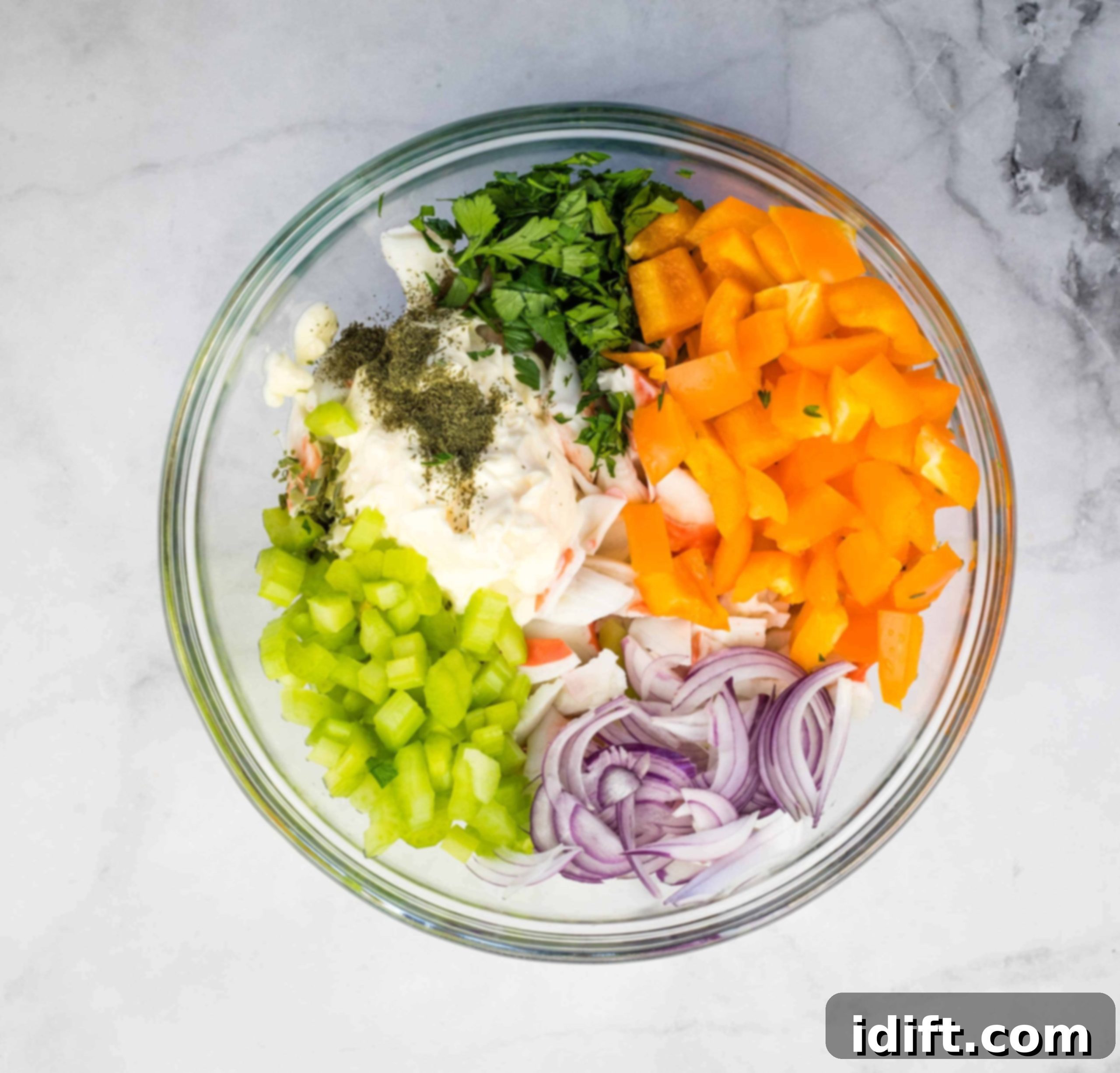Gourmet Seafood Medley 5 Deli seafood salad ingredients in a bowl before mixing