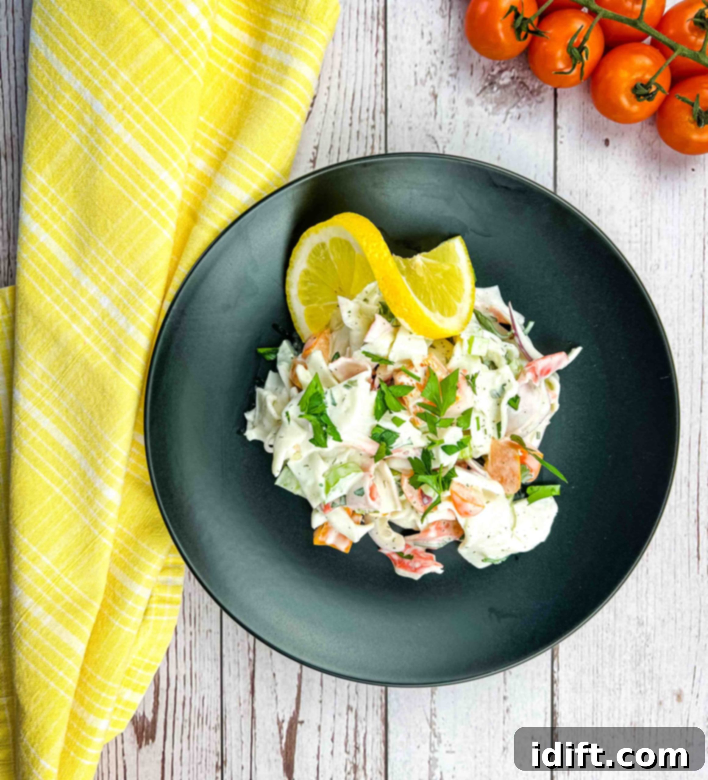 Gourmet Seafood Medley 6 Deli seafood salad mixed and on a black plate, ready to be served