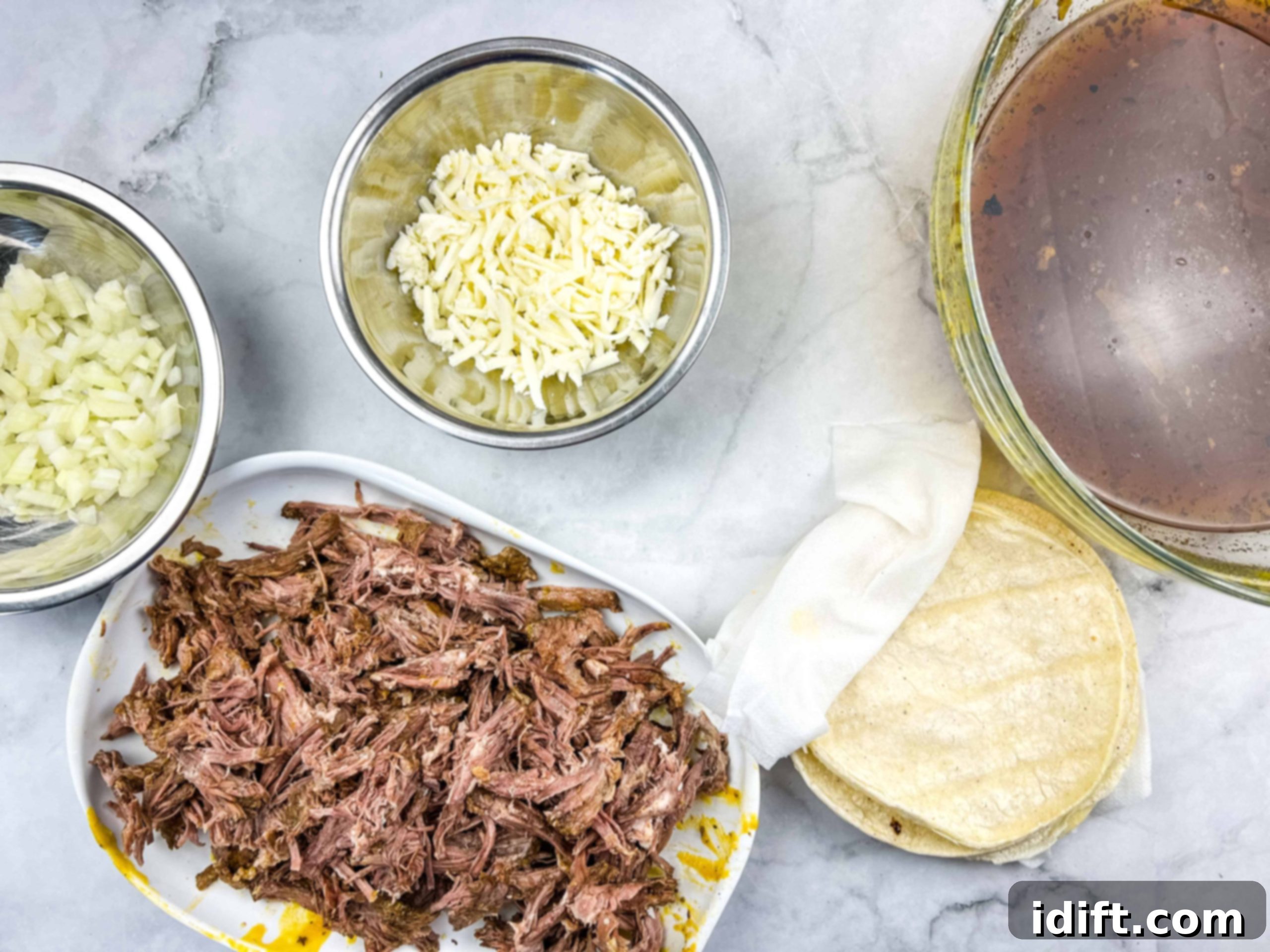 Birria taco ingredients ready for assembly.