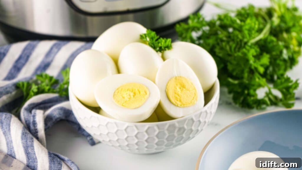 A bowl of freshly cooked Instant Pot hard-boiled eggs submerged in an ice bath to stop the cooking process.