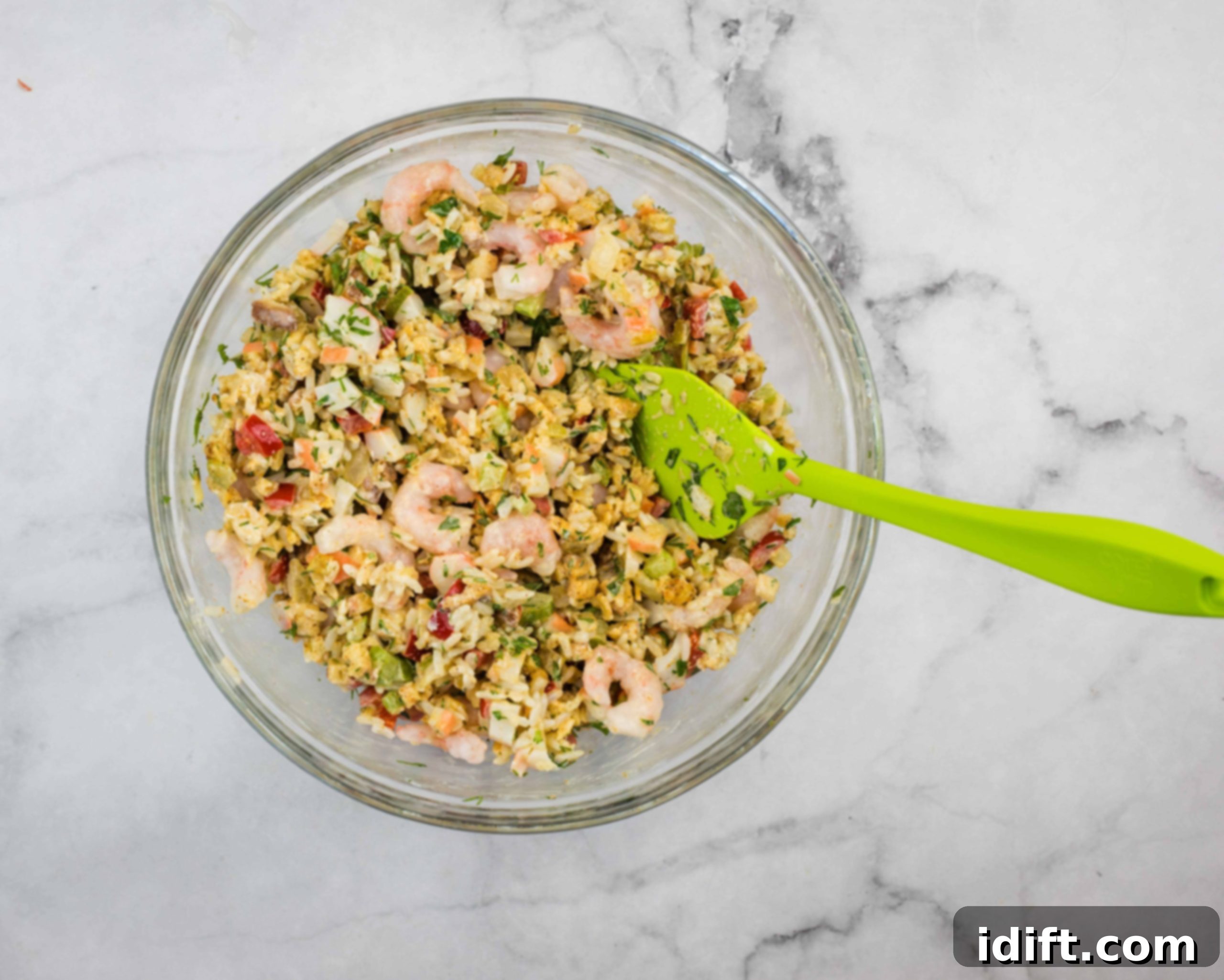 All seafood stuffing ingredients mixed together in a large bowl.